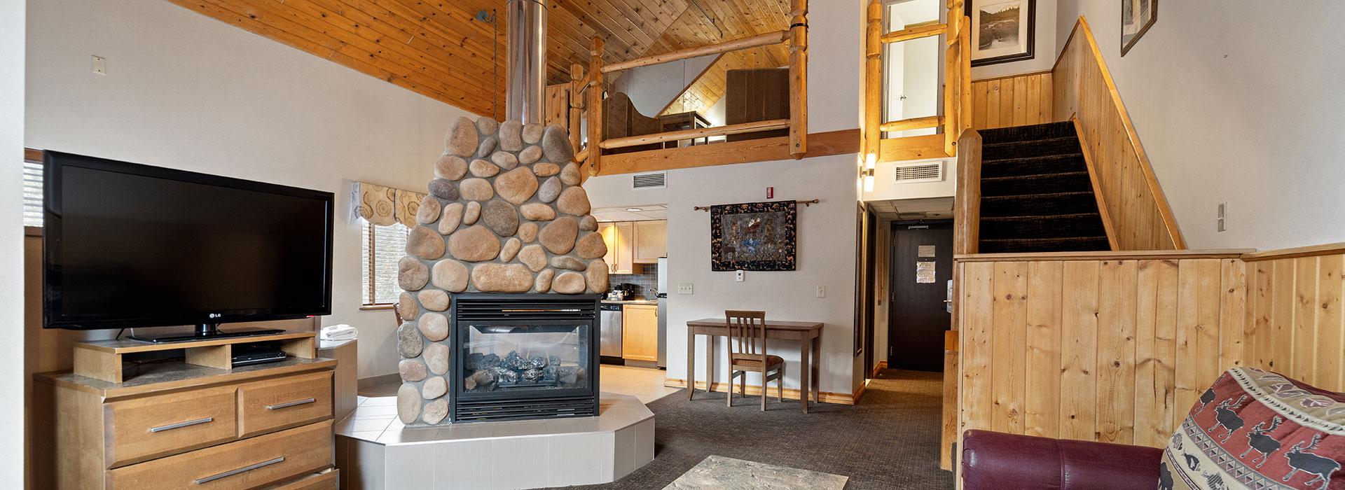 Hotel room with full living room and a loft